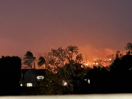 Darkened sky with fire in the distance of the Los Angeles skyline