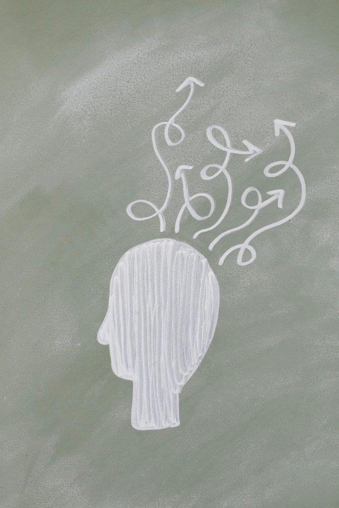 Drawing of a brain with arrows going in different directions