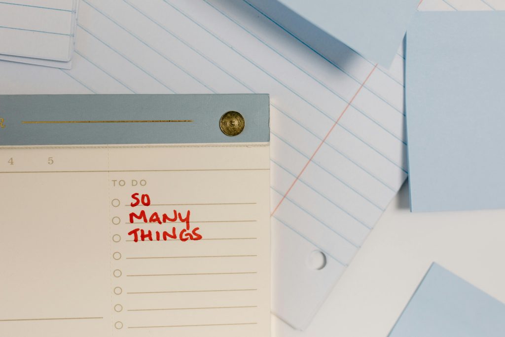 The words So Many Things under the phrase To Do on a notepad